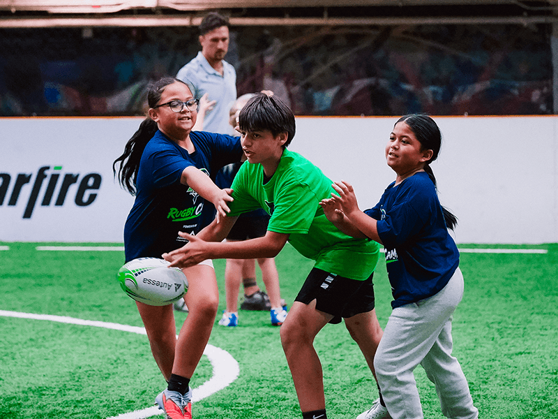 Young people take part in a Seawolves rugby clinic.