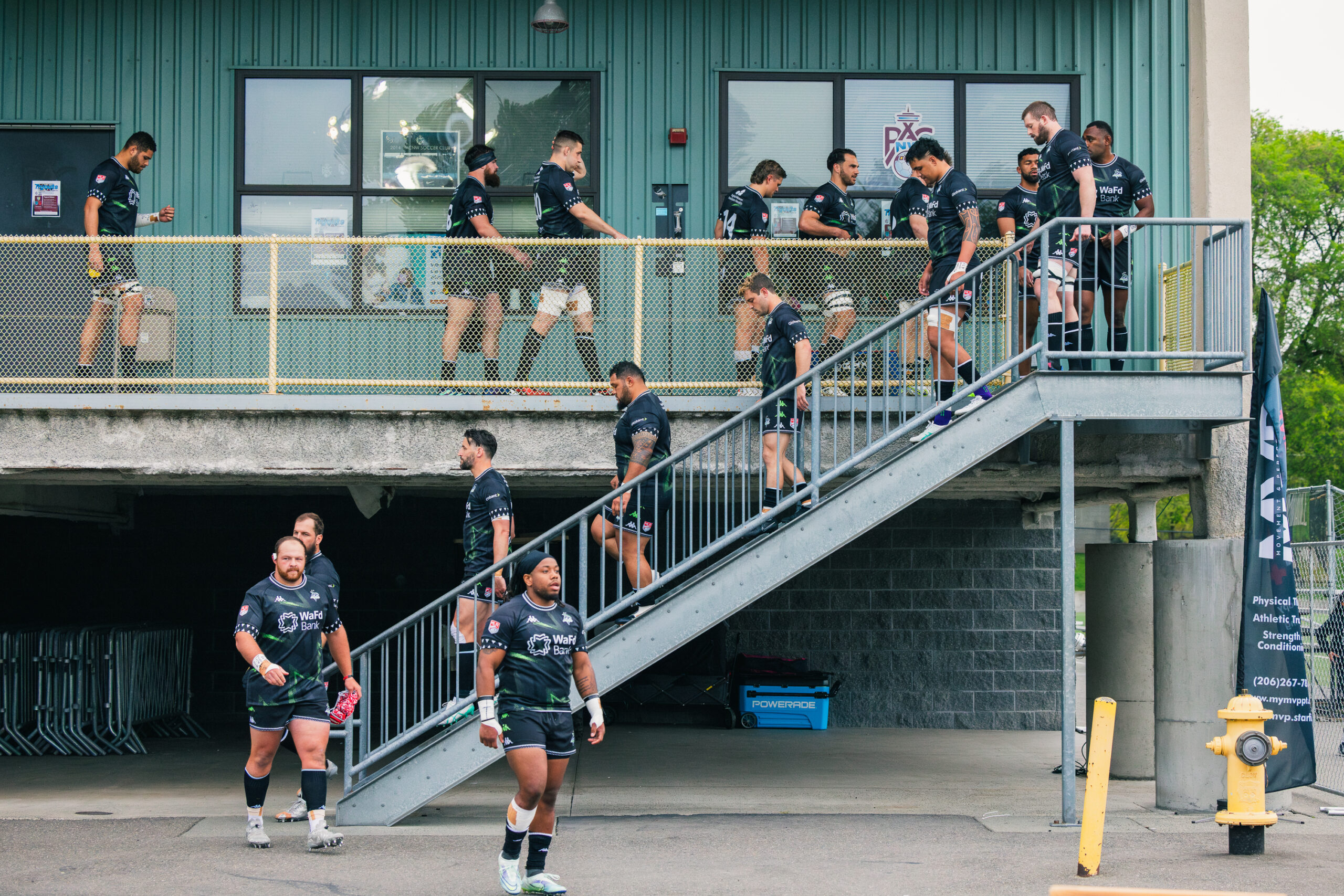 the seawolves players are leaving their changing room and walking down stairs